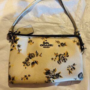 Coach Nolita Prarie print wristlet.